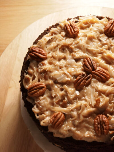 German Chocolate Cake showing the layers of chocolate cake and coconut pecan frosting.