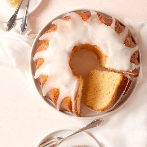 Close-up of a gluten-free bundt cake, showing intricate swirls and texture.