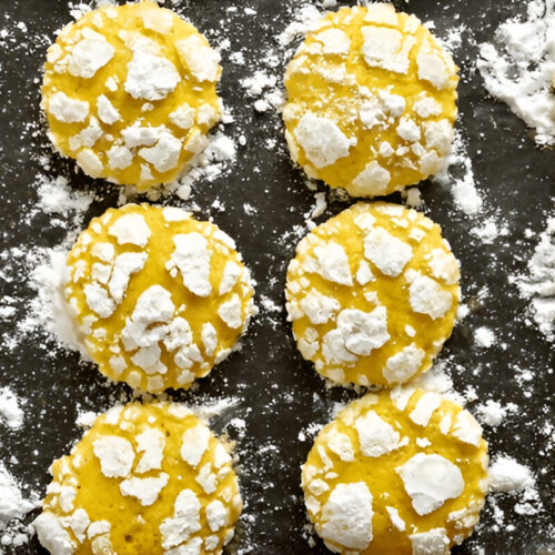 Close-up of soft lemon cake mix cookies cooling on a wire rack.