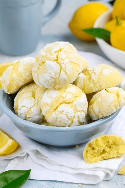 A bowl filled with soft, lemon-flavored cake mix cookies.