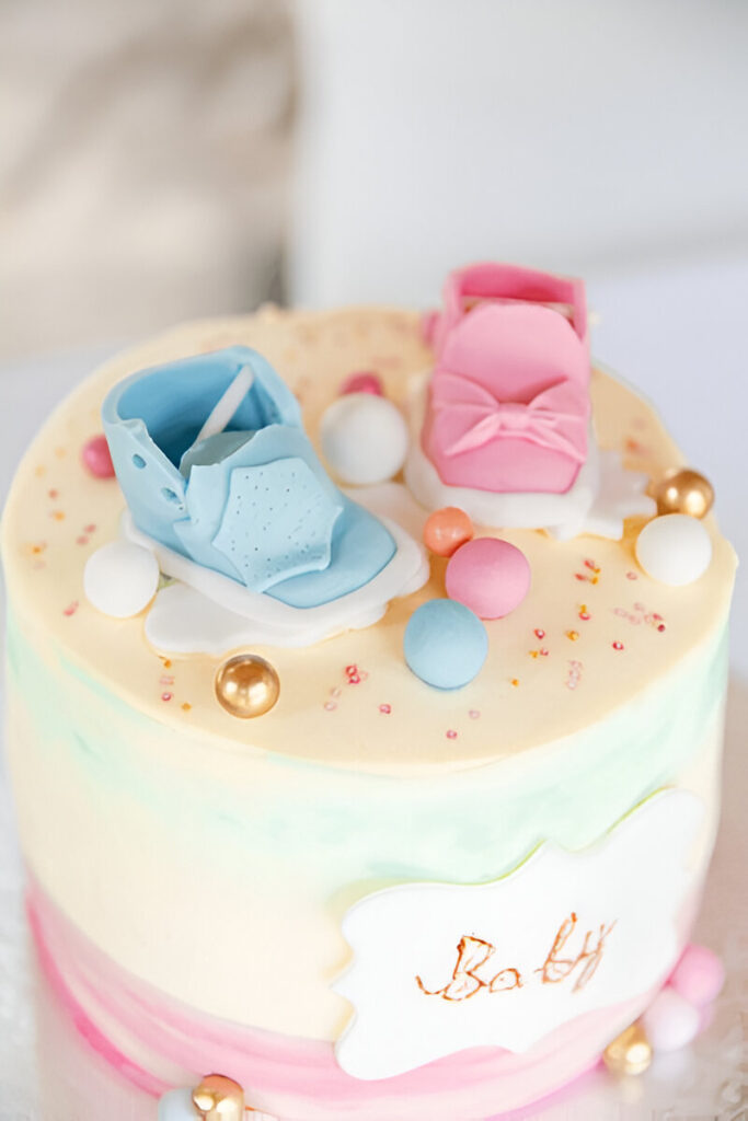 Ombre gender reveal cake in pink and blue shades.