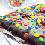 A whole tray of cosmic brownies, topped with chocolate frosting and colorful sprinkles.