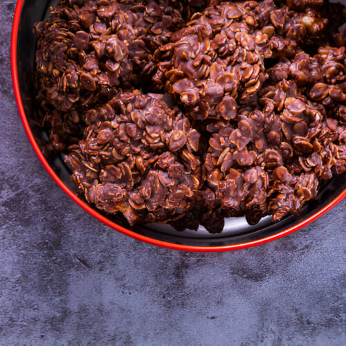 no-bake chocolate oatmeal cookies neatly arranged in a small box.