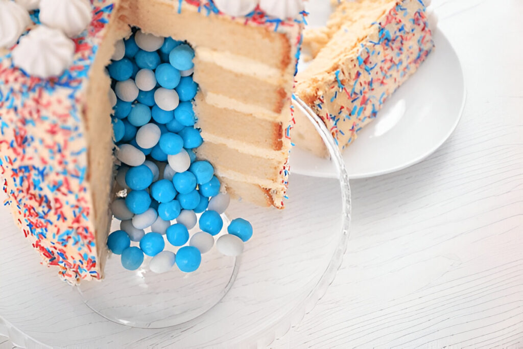 Gender reveal cake with colorful surprise filling.